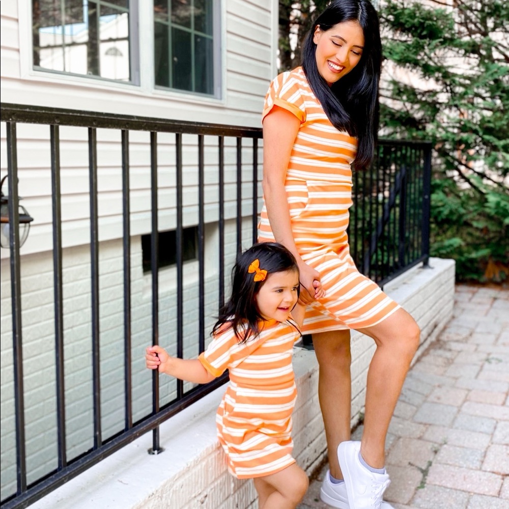 Mommy & me matching striped dresses. You get both for the price.
